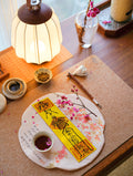 Handcrafted Taoist-inspired family peace talisman placed in a peaceful home setting.