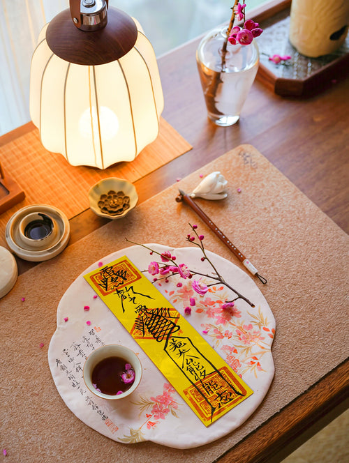 Handcrafted Taoist-inspired family peace talisman placed in a peaceful home setting.