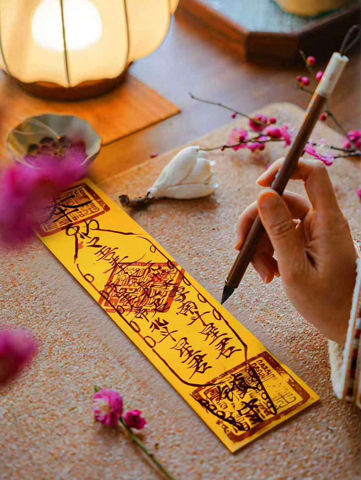 Handcrafted Taoist-inspired prosperity blessing talisman on a warm tabletop with soft light.